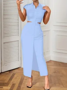 Detail of light blue sexy cut-out waist shirt dress with button-down front.