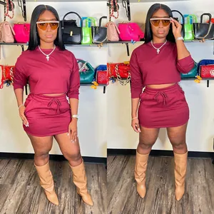 Trendy women's burgundy long sleeve crop top and mini skirt set for fashion outfits