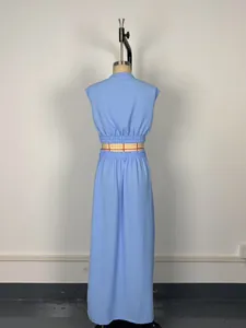 Rear view detail of light blue two-piece set with sleeveless cropped top and long maxi skirt