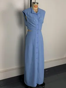 Detailed view of sky blue sleeveless maxi dress with waist cut-outs and button front