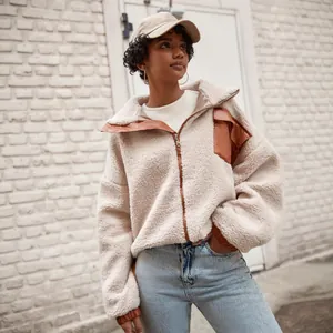Stylish women's sherpa jacket featuring brown PU leather trim and a functional chest pocket