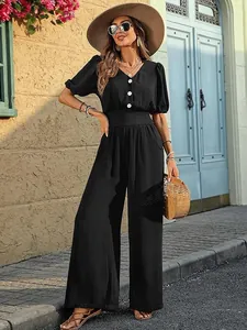 Elegant black short sleeve jumpsuit with wide leg design and waist cinching for women