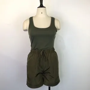 Two-piece women's olive green set with a sleeveless tank top and drawstring shorts