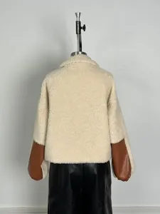 Back view detail of fleece jacket with brown PU leather sleeve patches