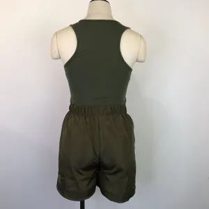 Back view of army green racerback tank top and loose casual shorts two-piece set