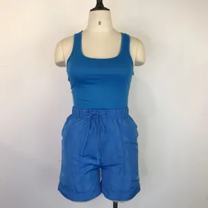 Two-piece blue summer set featuring a racerback tank top and loose casual shorts on mannequin