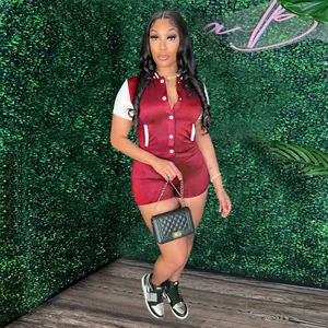Detailed view of women's short-sleeve button-up romper with contrast sleeves and slim fit