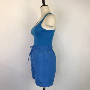 Side view detail of a blue racerback tank top and drawstring shorts casual summer set