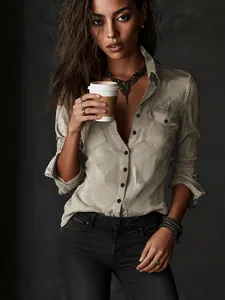 Detail of a vintage distressed khaki button-down shirt with pockets for casual wear