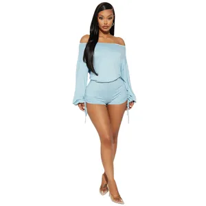 Close-up of light blue off-shoulder long sleeve romper with side drawstring ruched details