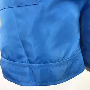 Close-up detail showing the fine stitching and blue fabric texture on a summer set