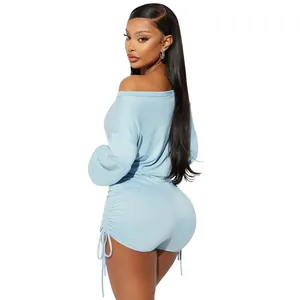 Detailed back view of a light blue off-shoulder romper featuring ruched drawstring sides