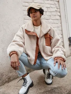 Casual women's beige sherpa jacket featuring brown PU leather trim and functional zipper