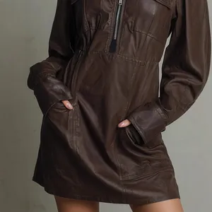 Close-up detail of a fashion brown PU leather polo neck dress with front zipper