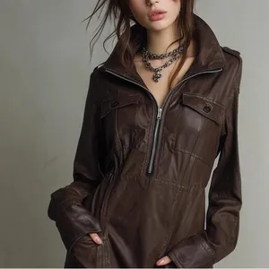 Close-up view of a brown PU leather long-sleeve dress featuring a zipper and polo collar.
