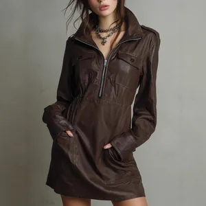 Detailed view of women's brown PU leather long sleeve dress with zipper and pockets