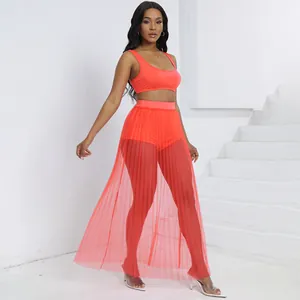 Set sexy 3 pezzi con top corto corallo, pantaloncini e gonna lunga in tulle plissettato