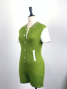 Detailed view of an olive green athletic bodysuit with white sleeves on a mannequin.
