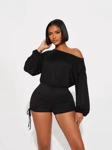 Elegant black off-the-shoulder long sleeve romper with ruched drawstring shorts