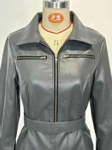 Detail view of the fitted grey PU leather blazer dress with zipper accents