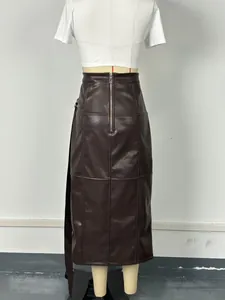 Detailed back view of a stylish brown PU leather A-line skirt with zipper and stitching.