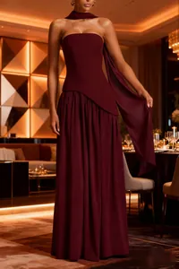Elegant burgundy strapless evening gown featuring a pleated skirt and matching scarf