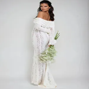 Side view of white lace off-the-shoulder dress with elegant trumpet sleeves
