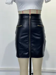 Detailed shot of a black high-waisted PU leather mini skirt with front zipper design