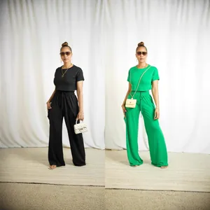 Dual view of model wearing black and green two-piece crop top and wide-leg pants sets.