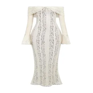 Detailed view of the intricate beige lace texture and elegant off-shoulder design on this dress