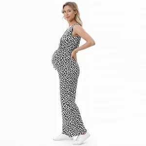 Side view of stylish leopard print maternity jumpsuit on model in a white studio setting