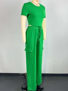 Vibrant green two-piece set with short sleeve top and wide-leg cargo pants detail view