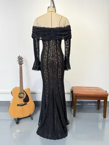 Detailed back view of an elegant black lace off-the-shoulder evening gown with bell sleeves.