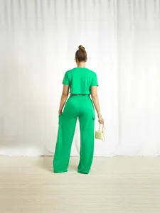 Fashionable green two-piece set featuring a short sleeve crop top and wide-leg cargo pants