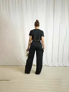 Women's chic black two-piece set with short sleeve crop top and wide-leg cargo pants