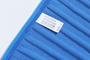 Close-up detail showing soft cotton ribbed fabric and care label of blue thong