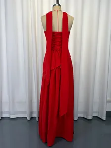Detailed back view of a red strapless evening dress with lace-up and long streamers