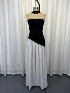 Elegant black and white strapless halter dress with a flowing white maxi skirt