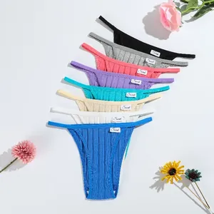 Close-up detail of women's ribbed low-waist thong underwear in multiple vibrant colors