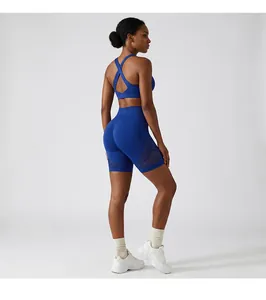 Womens blue athletic yoga set featuring cross-back sports bra and mesh breathable gym shorts