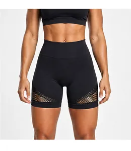 Detail of black high-waisted yoga shorts with breathable mesh panels for fitness