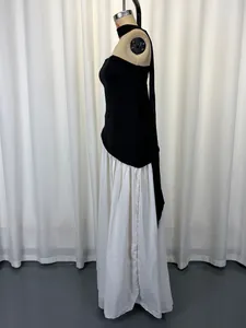Side view of a sexy halter-neck dress with a black strapless bodice and long white skirt