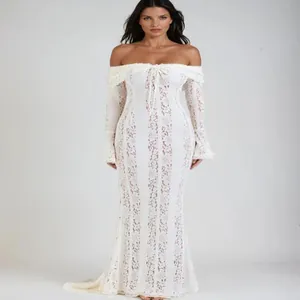 Elegant white lace off-shoulder mermaid dress with bell sleeves and hollow-out design.