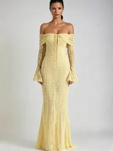 Elegant yellow lace off-shoulder maxi dress with flare sleeves and mermaid silhouette
