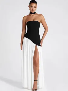 Elegant strapless black and white color-block maxi dress with high slit and choker.