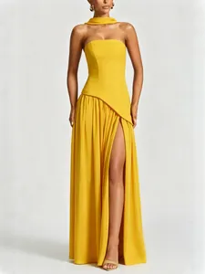 Elegant yellow strapless slit gown with a neck streamer, perfect for formal events.