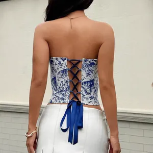 Back view of French jacquard corset top with butterfly print and lace-up blue ribbon
