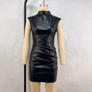 Close-up detail of black ruched PU leather mini dress featuring high neck and sleeveless cut