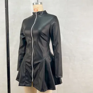 Detail of black long-sleeve PU leather dress with front zipper and pleated skirt