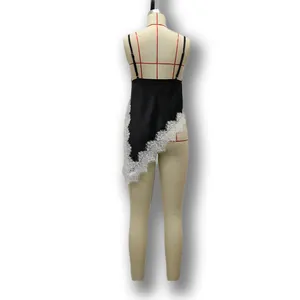 Detailed back view of a black satin camisole featuring asymmetric white lace trim